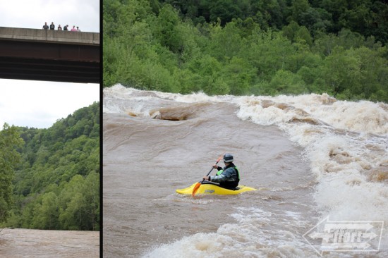 Onlookers enjoy the view while Eric crosses the top wave alongside river right.